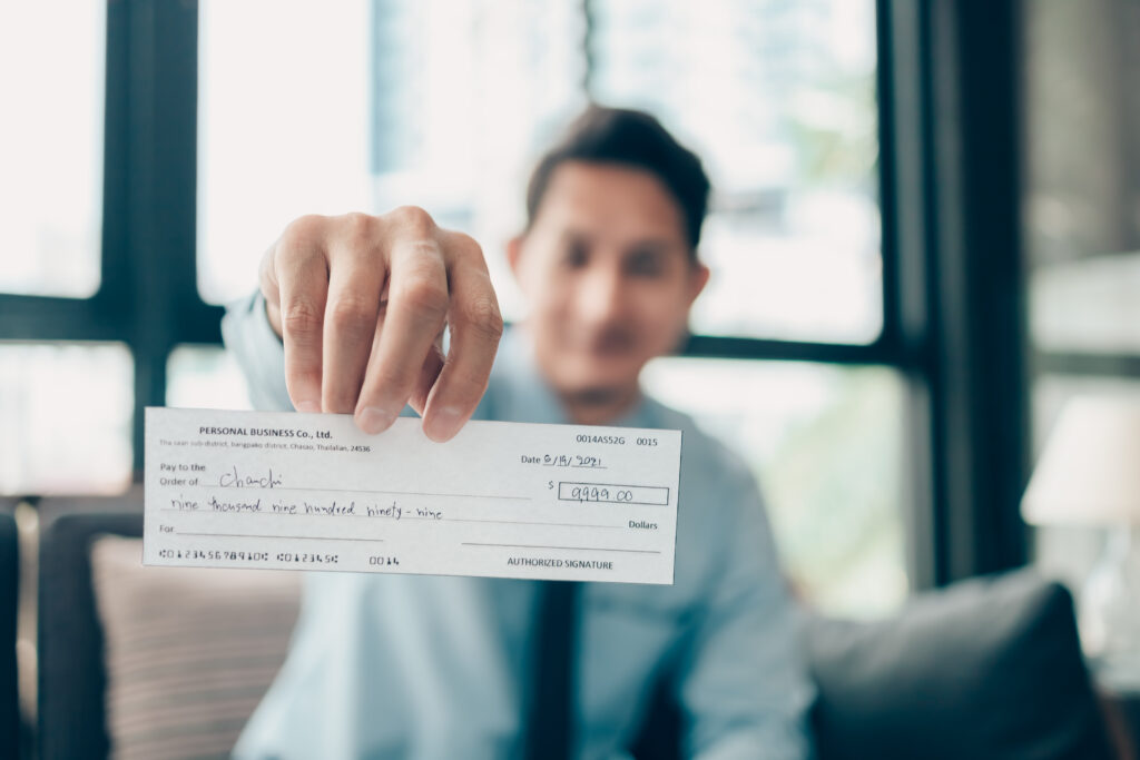 Man holding check in hand